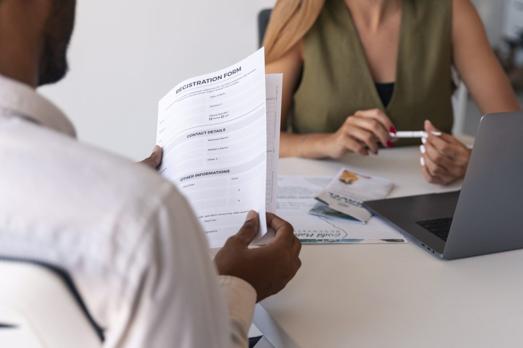 Person filling out online health insurance form for Spain